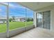 Screened lanai overlooking a well-maintained backyard and manicured landscaping at 1768 Sw 156Th Ln, Ocala, FL 34473