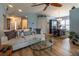 Bright and airy living room with comfortable sofa, a glass coffee table, and dining area at 1768 Sw 156Th Ln, Ocala, FL 34473