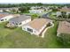Back of home featuring a screened in porch, manicured yard, and mature trees at 1768 Sw 156Th Ln, Ocala, FL 34473