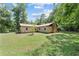 Expansive backyard with a brick home, mature trees, and a well-maintained lawn at 19130 Nw 60Th Ave, Reddick, FL 32686