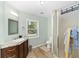 Bathroom featuring a new vanity and walk-in shower at 19130 Nw 60Th Ave, Reddick, FL 32686