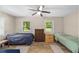 Bedroom featuring two beds and plenty of natural light at 19130 Nw 60Th Ave, Reddick, FL 32686