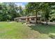 Well-maintained home with lush landscaping, large yard, and inviting curb appeal with a two-car garage at 19130 Nw 60Th Ave, Reddick, FL 32686