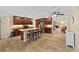 Modern kitchen with an island with seating, stainless steel appliances, and sleek wood cabinetry at 19130 Nw 60Th Ave, Reddick, FL 32686
