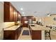 Spacious kitchen with stainless appliances, granite countertops and island seating at 19130 Nw 60Th Ave, Reddick, FL 32686