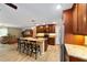 Open concept kitchen features granite counters, stainless steel appliances, and seating at the island at 19130 Nw 60Th Ave, Reddick, FL 32686