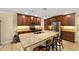 Kitchen featuring granite counters, stainless steel appliances, and a large island with seating at 19130 Nw 60Th Ave, Reddick, FL 32686