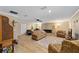 Large living room featuring a fireplace and ample seating at 19130 Nw 60Th Ave, Reddick, FL 32686