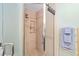 Bathroom featuring walk-in tiled shower with modern fixtures at 19130 Nw 60Th Ave, Reddick, FL 32686