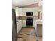 Well-lit kitchen features stainless appliances, granite countertops, and ample cabinetry at 19622 Sw Marine Blvd, Dunnellon, FL 34431