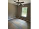 Cozy bedroom with natural light and ceiling fan at 20769 Sw Oriole Dr, Dunnellon, FL 34431