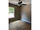Cozy bedroom with natural light and ceiling fan at 20769 Sw Oriole Dr, Dunnellon, FL 34431