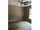 Bright bedroom with ceiling fan, natural light, and neutral paint at 20769 Sw Oriole Dr, Dunnellon, FL 34431