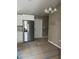 Well-lit eat-in kitchen featuring stainless steel refrigerator and white cabinets at 20769 Sw Oriole Dr, Dunnellon, FL 34431