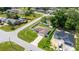 Charming single-story home with a well-manicured lawn, surrounded by a clean white fence and lush greenery at 28 Hemlock Radial Loop, Ocala, FL 34472