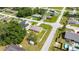 Lovely home with green lawn and white fence situated in a quiet neighborhood with mature trees at 28 Hemlock Radial Loop, Ocala, FL 34472