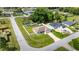 Aerial view of single-Gathering home with fenced yard, long driveway and well-maintained lawn at 28 Hemlock Radial Loop, Ocala, FL 34472