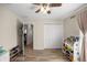 bedroom featuring wood-look floors, neutral walls, and a large closet at 28 Hemlock Radial Loop, Ocala, FL 34472