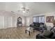 Inviting living room features wood-look tile flooring, sofas, and a stylish accent table at 28 Hemlock Radial Loop, Ocala, FL 34472