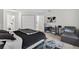 Well-lit bedroom featuring tiled floors and ample closet space at 316 Oak Track Dr, Ocala, FL 34472
