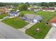 Exterior view of a charming home featuring a well-manicured lawn and long driveway at 316 Oak Track Dr, Ocala, FL 34472