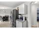 Modern kitchen with stainless steel refrigerator and white cabinetry at 316 Oak Track Dr, Ocala, FL 34472