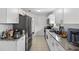 Well-equipped kitchen featuring modern appliances, granite countertops, and plenty of cabinet space for storage at 316 Oak Track Dr, Ocala, FL 34472