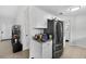 The well-equipped kitchen features granite countertops, a stainless-steel refrigerator and a breakfast area for dining at 316 Oak Track Dr, Ocala, FL 34472