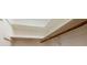 Unfinished attic space with open wooden shelves and a bat at 4121 Sw 6Th Ave, Ocala, FL 34471