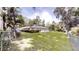 Expansive backyard featuring lush greenery, mature trees, and a screened in pool area, perfect for outdoor enjoyment at 4121 Sw 6Th Ave, Ocala, FL 34471