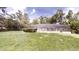 A spacious, green backyard featuring an enclosed swimming pool, ideal for relaxation at 4121 Sw 6Th Ave, Ocala, FL 34471