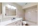 Bathroom boasts a vanity with drawers and a shower-tub combo with tile surround at 4121 Sw 6Th Ave, Ocala, FL 34471