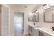 Bathroom with double vanity, sleek fixtures, and open doorway at 4121 Sw 6Th Ave, Ocala, FL 34471