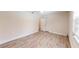 A serene bedroom featuring wood-look flooring, natural light, and closet space at 4121 Sw 6Th Ave, Ocala, FL 34471