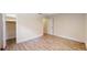 Bedroom with light hardwood floors, two doors, and a closet with white louvered doors at 4121 Sw 6Th Ave, Ocala, FL 34471