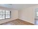 Bright bedroom with vinyl flooring and neutral walls, featuring a window for natural light at 4121 Sw 6Th Ave, Ocala, FL 34471