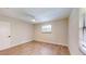 Clean bedroom with hardwood floors, a ceiling fan, and window at 4121 Sw 6Th Ave, Ocala, FL 34471
