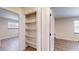 Bedroom closet with bi-fold doors and shelving providing ample storage space at 4121 Sw 6Th Ave, Ocala, FL 34471