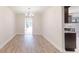 Dining area with wood-look flooring, and modern light fixture at 4121 Sw 6Th Ave, Ocala, FL 34471