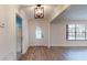 Bright entryway with a decorative glass door and wood-look flooring at 4121 Sw 6Th Ave, Ocala, FL 34471