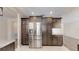 Kitchen featuring stainless steel refrigerator and dark wood cabinetry at 4121 Sw 6Th Ave, Ocala, FL 34471