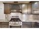 Updated kitchen with stainless steel appliances and subway tile backsplash at 4121 Sw 6Th Ave, Ocala, FL 34471