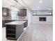 Well-appointed kitchen and living room area with brick fireplace at 4121 Sw 6Th Ave, Ocala, FL 34471