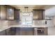 Kitchen showcasing stainless steel appliances and sink with a pool view at 4121 Sw 6Th Ave, Ocala, FL 34471