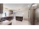 Stylish kitchen featuring dark cabinets, stainless steel appliances, and marble countertops at 4121 Sw 6Th Ave, Ocala, FL 34471