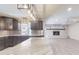 Well-designed kitchen features stone countertops, stylish cabinets, and a fireplace nearby at 4121 Sw 6Th Ave, Ocala, FL 34471