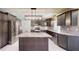 Spacious kitchen showcasing a center island, stainless appliances, and ample cabinets at 4121 Sw 6Th Ave, Ocala, FL 34471