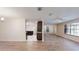 Inviting open living area with vinyl floors, seamless transition to the kitchen and dining area at 4121 Sw 6Th Ave, Ocala, FL 34471