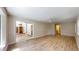 Living room featuring hardwood floors, a ceiling fan, and a glass sliding door at 4121 Sw 6Th Ave, Ocala, FL 34471