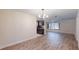 Spacious living room with wood floors and a stylish chandelier at 4121 Sw 6Th Ave, Ocala, FL 34471
